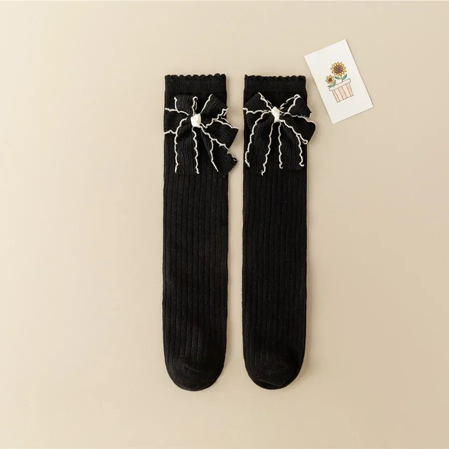 Calcetines largos con lazo para niña – Algodón suave blanco y negro - imagen 4