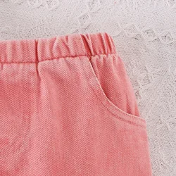 Conjunto bebé primavera: top mariposa blanco y vaquero acampanado