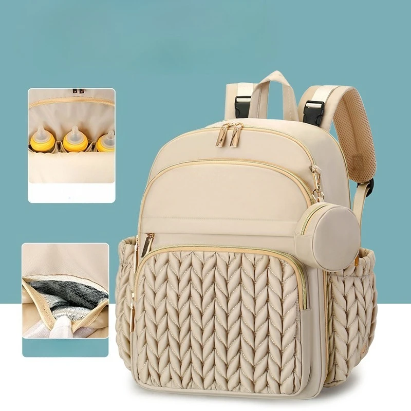 Mochila pañales con cambiador y accesorios para bebé en marcha - imagen 2