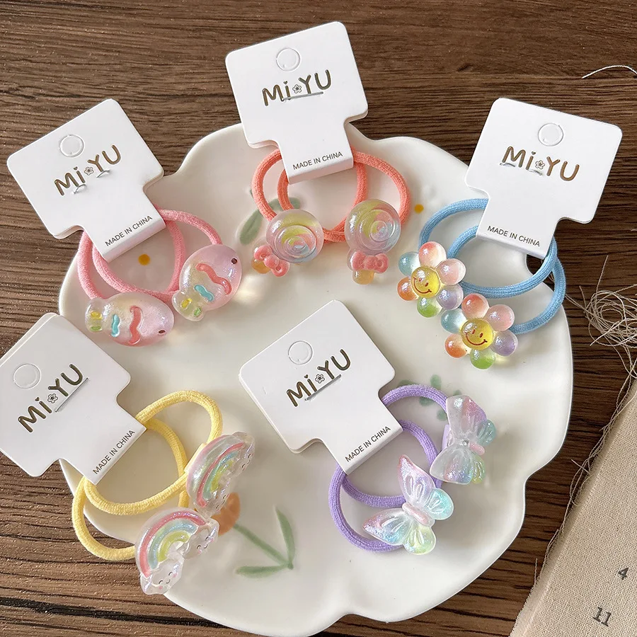 Diadema transparente con dibujos animados y mariposa arcoíris