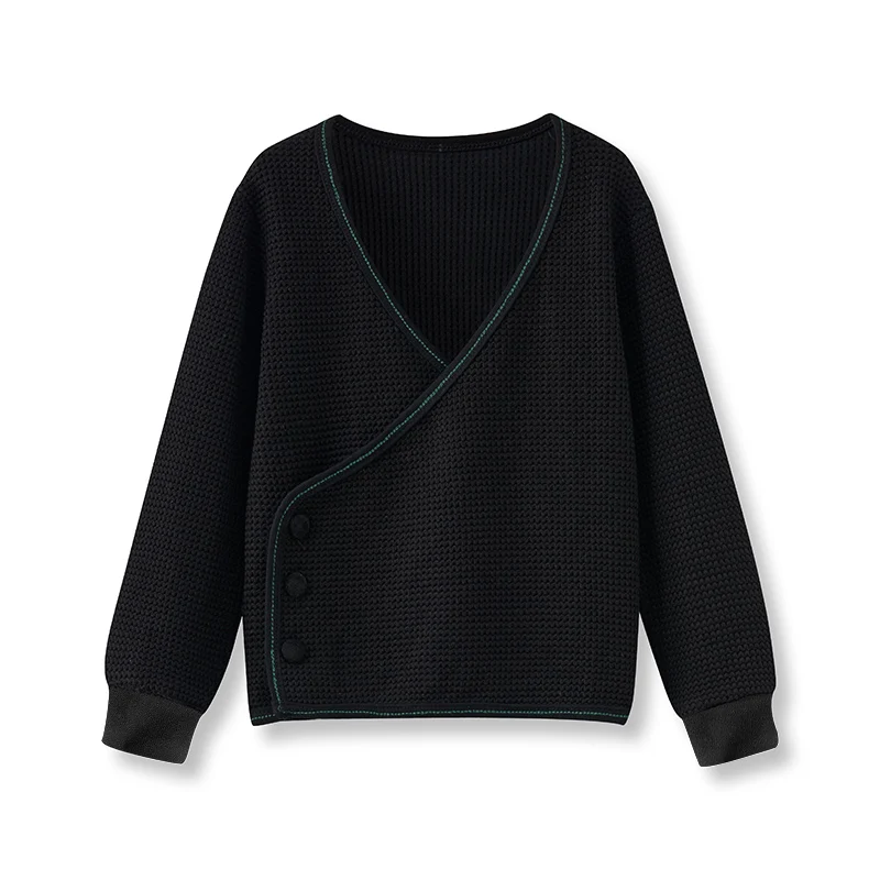 Jersey negro de punto con botones de terciopelo para niños