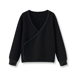 Jersey negro de punto con botones de terciopelo para niños