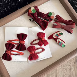 Pinza de pelo infantil roja con lazo de terciopelo y lentejuelas