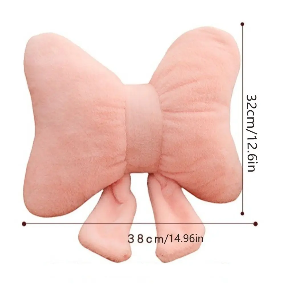 Almohada de peluche con lazo en tono blanco