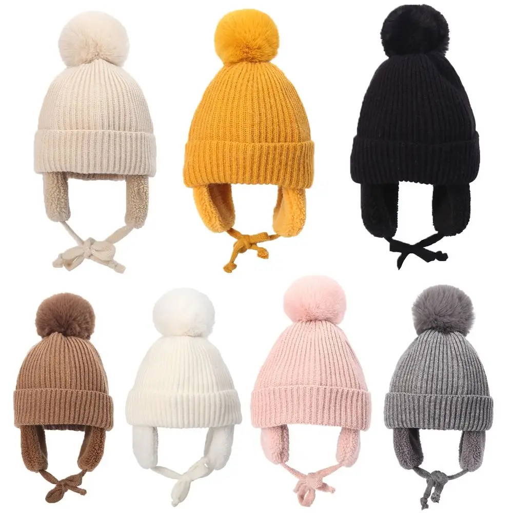 Gorro con orejeras cálidas a prueba de viento para niños en uso