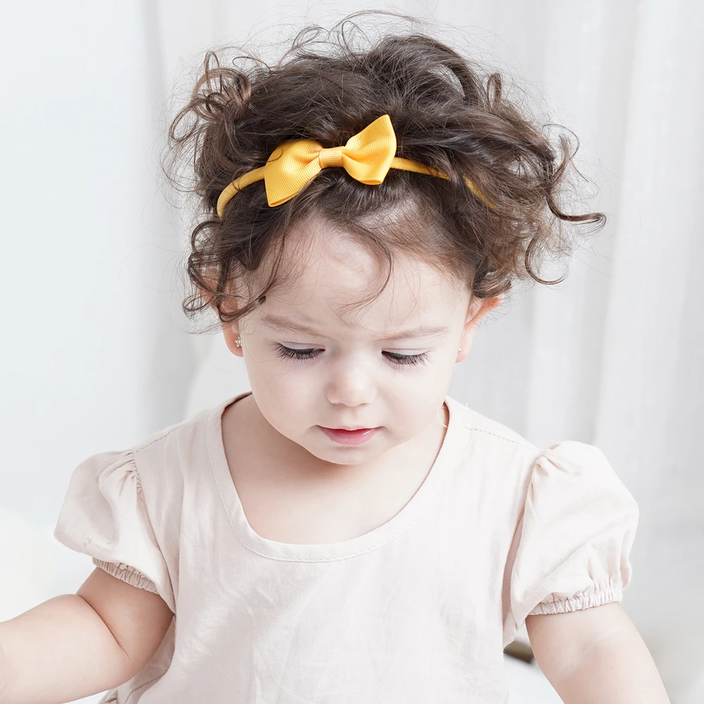 Diadema elástica para niñas con lazos y flores en tonos suaves - imagen 5