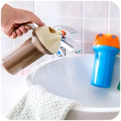 Cuchara de ducha infantil con rana dibujada para baño