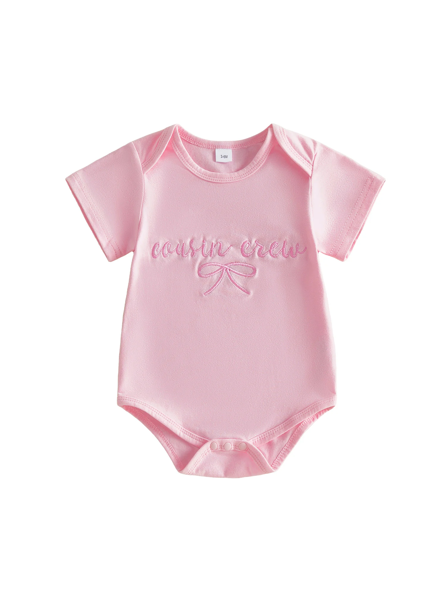 Mono de bebé niña rosa con letras bordadas y lazo