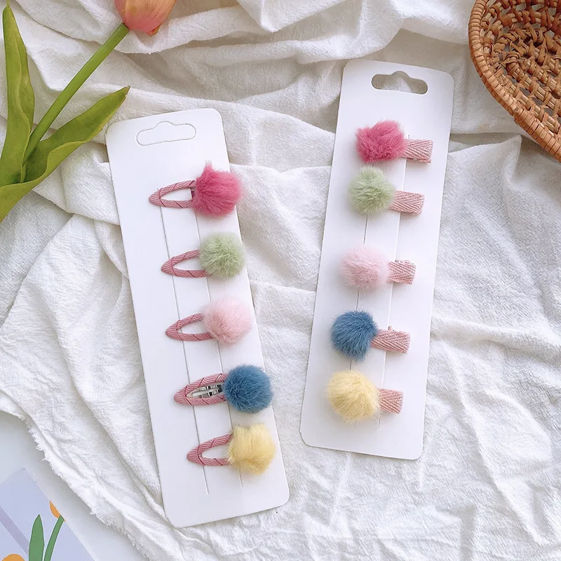 Mini pinzas coloridas para bebé con bolas de felpa