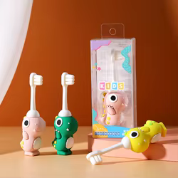 Cepillo de dientes infantil con dinosaurio y cerdas suaves