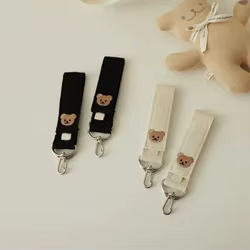 Gancho universal cochecito con diseño animado y duradero para bolsas