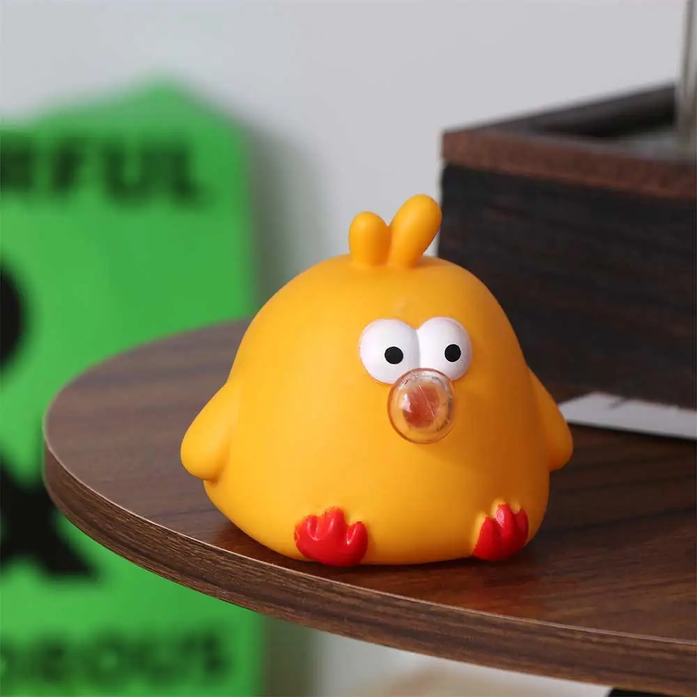 Juguete de apretar de pollo amarillo con diseño infantil