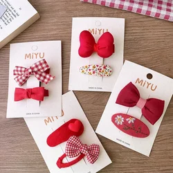 Pinzas para el pelo de niña con lazo rojo y cerezas a cuadros