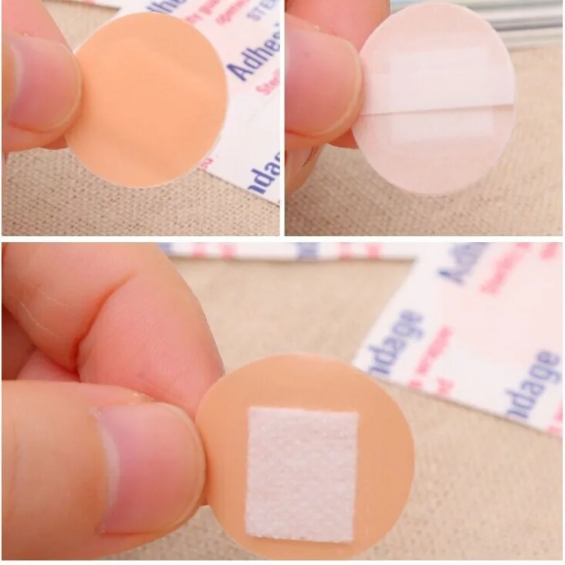 Set de 100 tiritas redondas Woundplast en su empaque