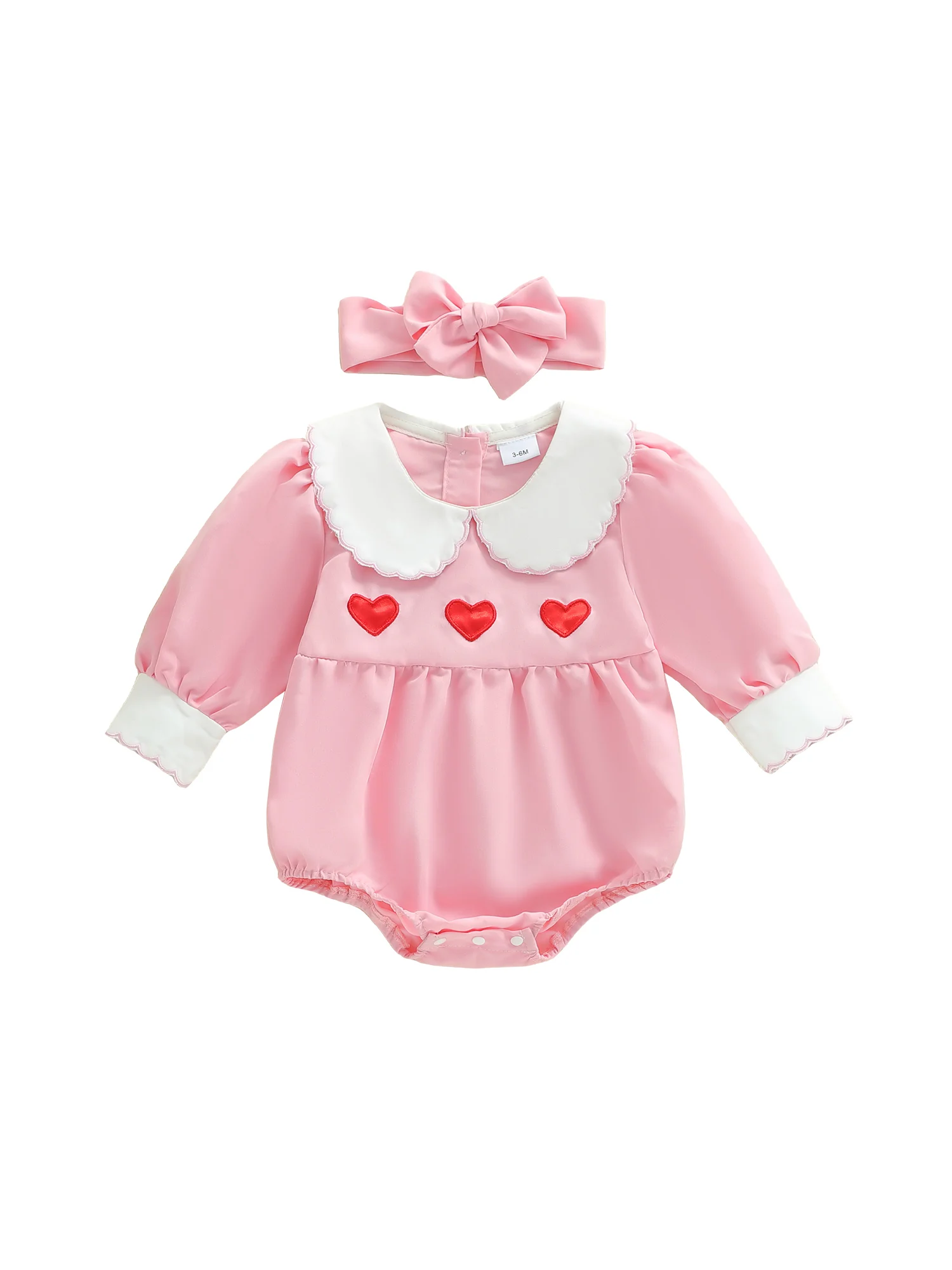 Barboteuse rosa con corazón bordado