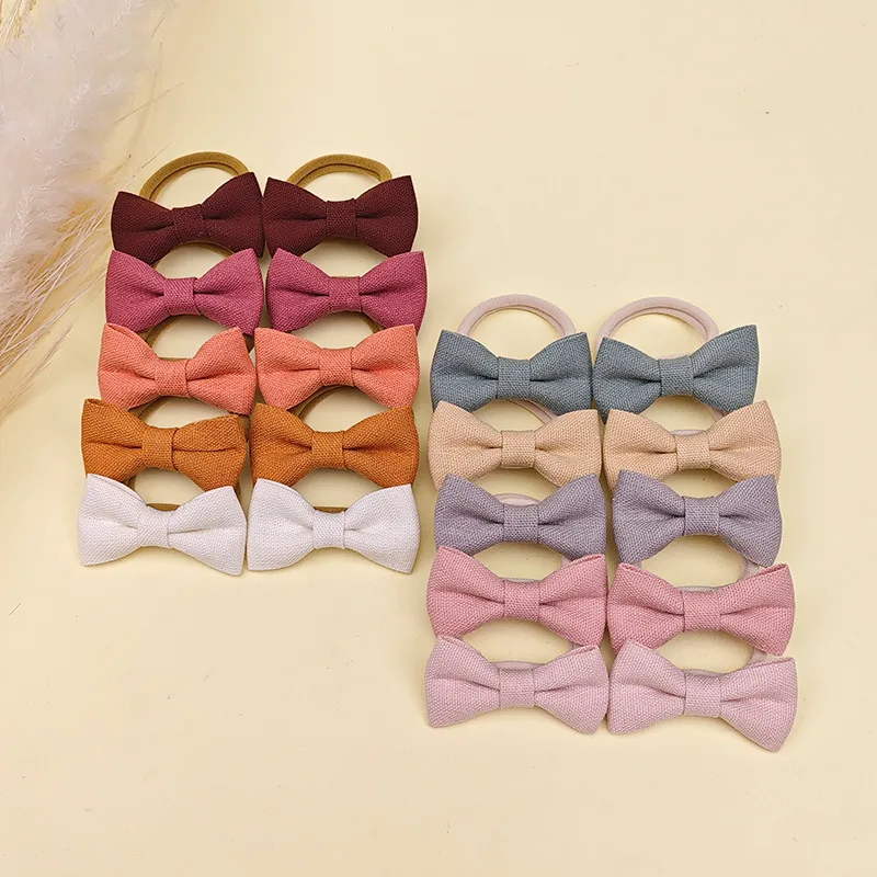 Elásticos de pelo arco suave en algodón y lino para niña
