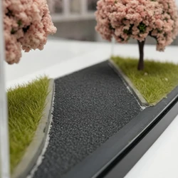 Diorama de flor de cerezo con miniatura de coche en acrílico