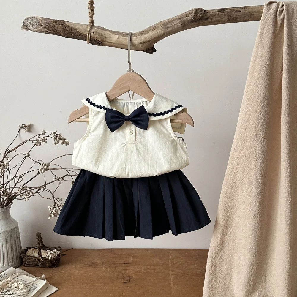 Conjunto marinero con lazo y falda plisada
