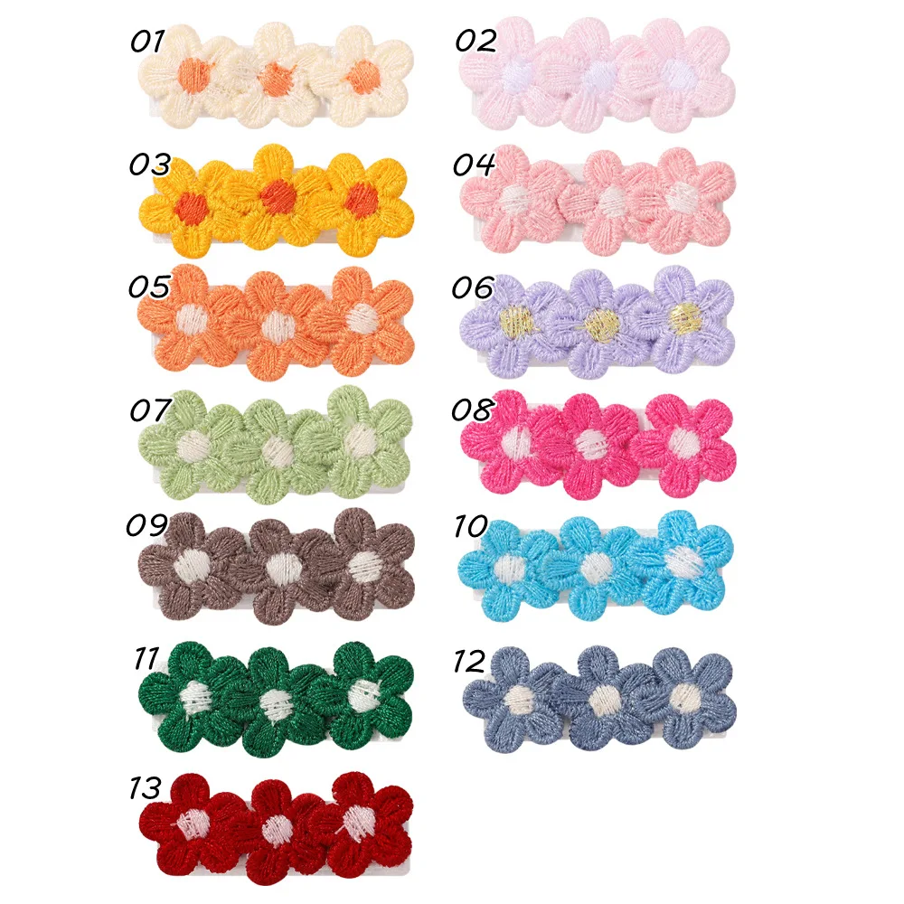 Mini pinzas con flores tejidas para bebés
