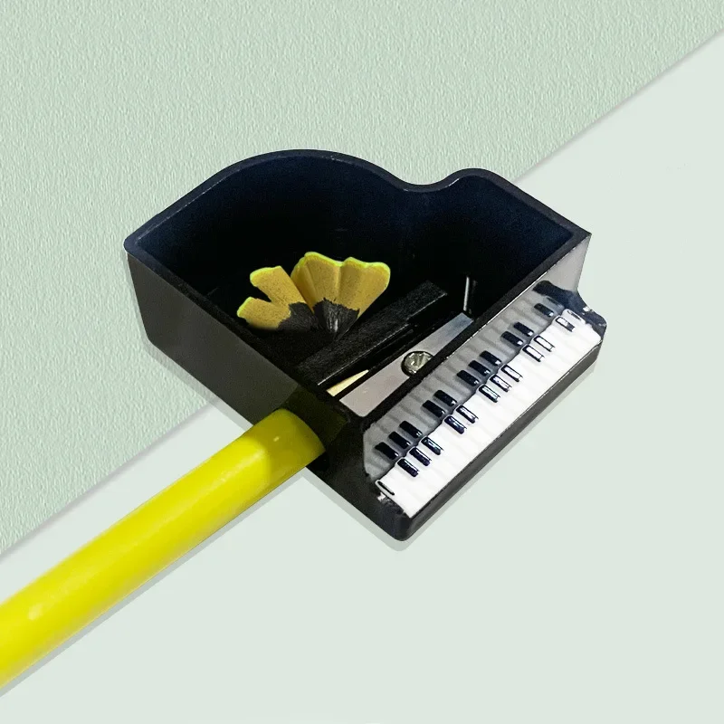 Sacapuntas con forma de piano musical para estudiantes y niños