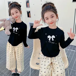 Conjunto niña de blusa con lazo primaveral y pantalón