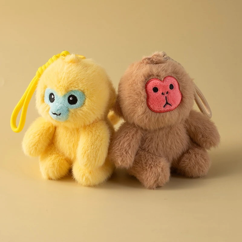Colgante de peluche con mono dorado como llavero