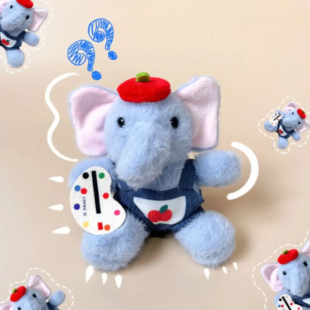 Mochila infantil con elefante de peluche y delantal de pintor - imagen 3