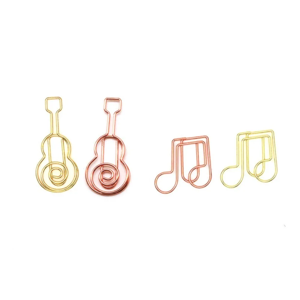 Marcapáginas metálicos musicales con forma de nota y guitarra