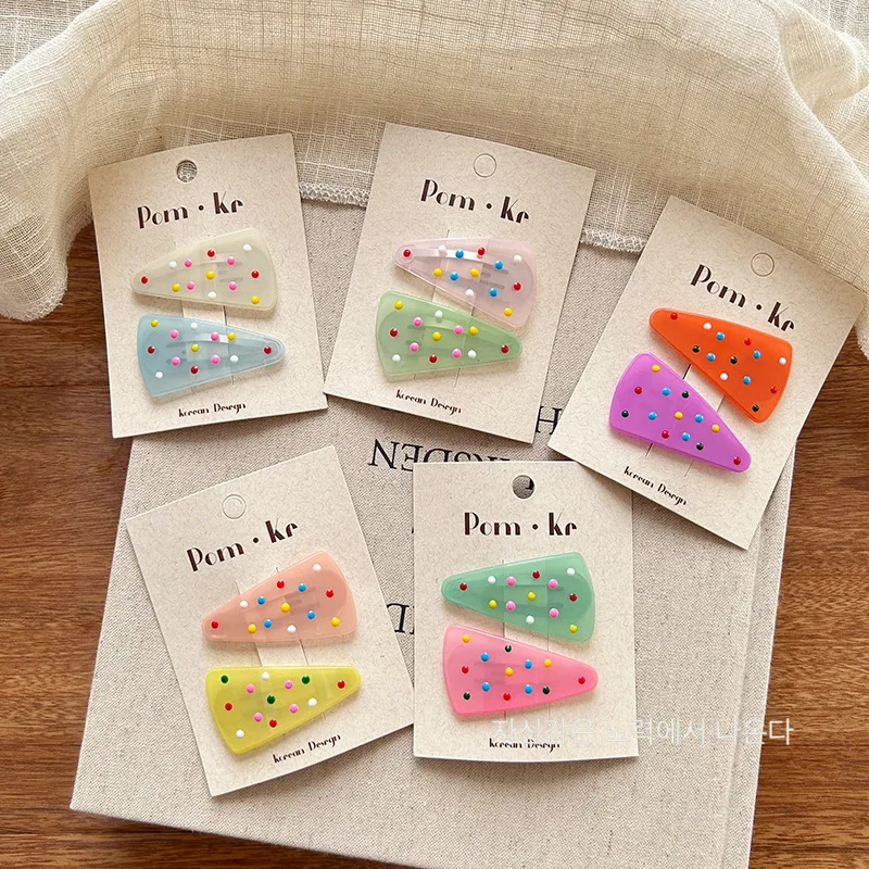 Pinzas triangulares de gelatina pastel con lunares para niños - imagen 3