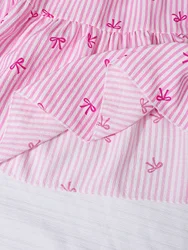 Falda midi de rayas verticales rosas con lazos pequeños para niño