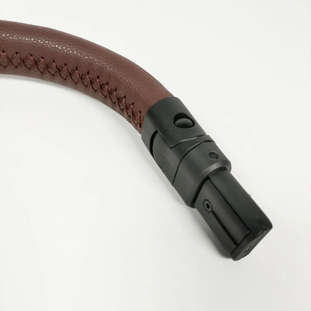 Vista lateral del cochecito con la barra instalada