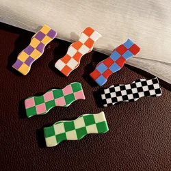 Clips para el pelo con patrón ajedrezado negro y blanco, sin marcas