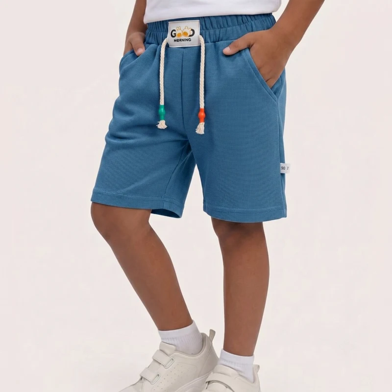 Pantalones cortos de niño color caramelo con cintura elástica