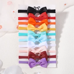 Diadema elástica para niñas con lazos y flores en tonos suaves