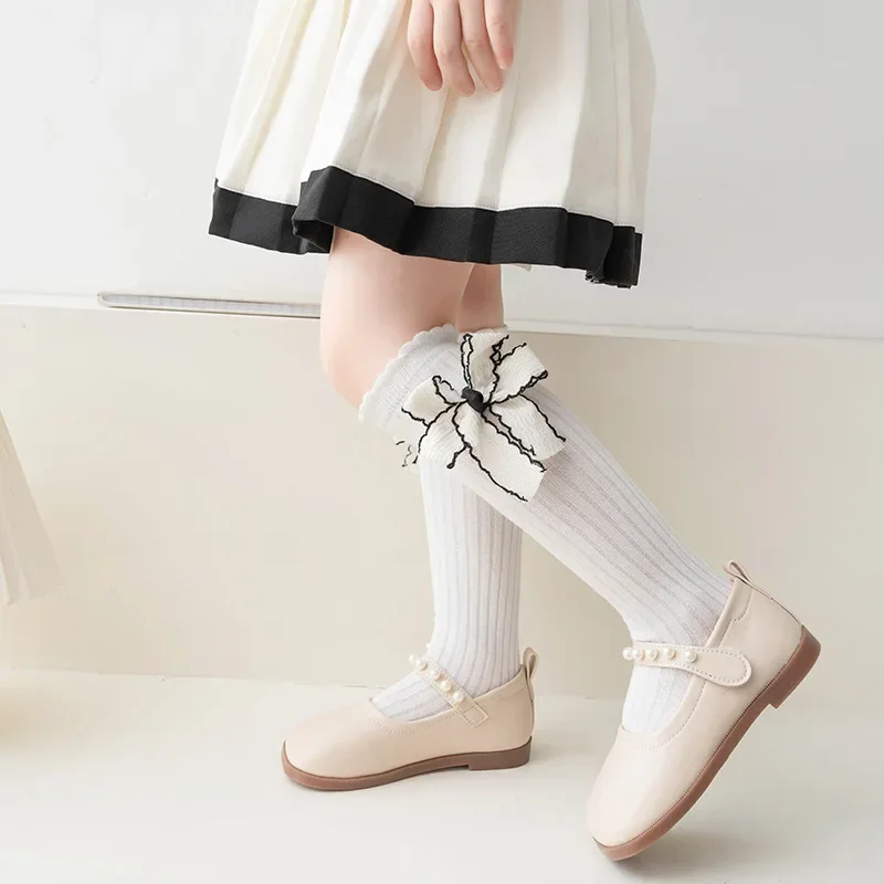 Calcetines largos con lazo para niña – Algodón suave blanco y negro
