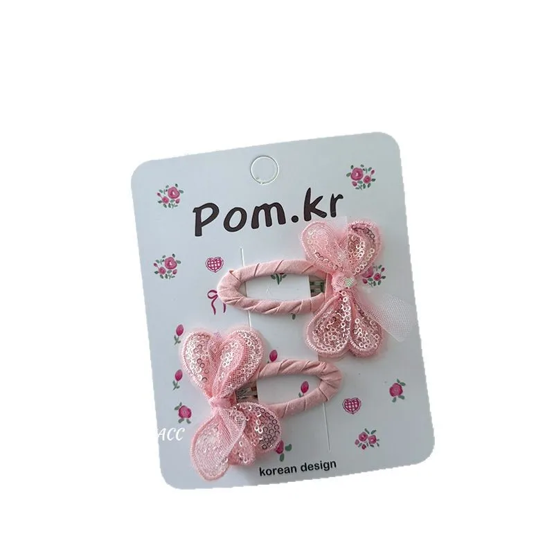 Pinzas de pelo infantiles con lazos y brillo de lentejuelas