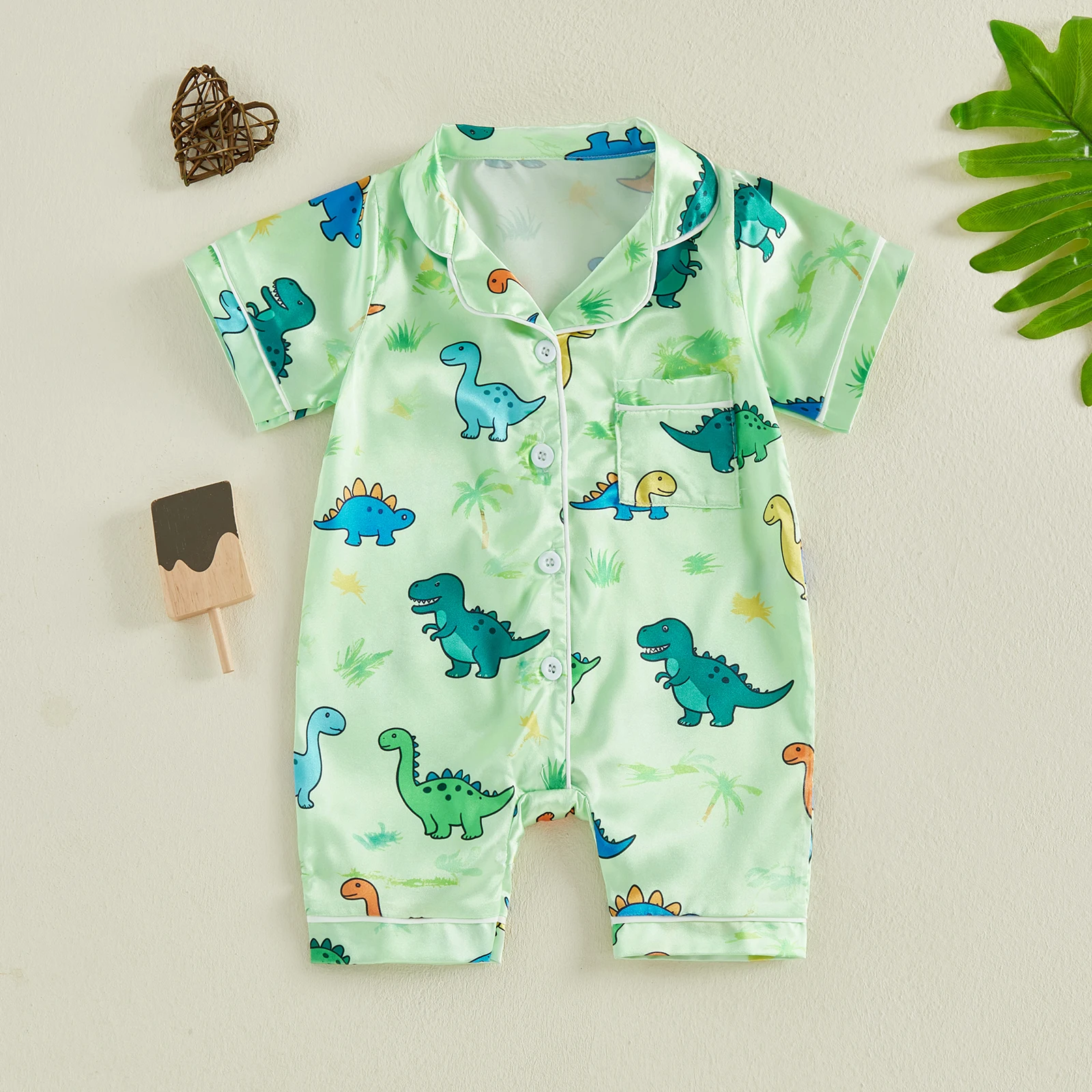 Pijama bebé con dinosaurios y cuello vuelto, manga corta