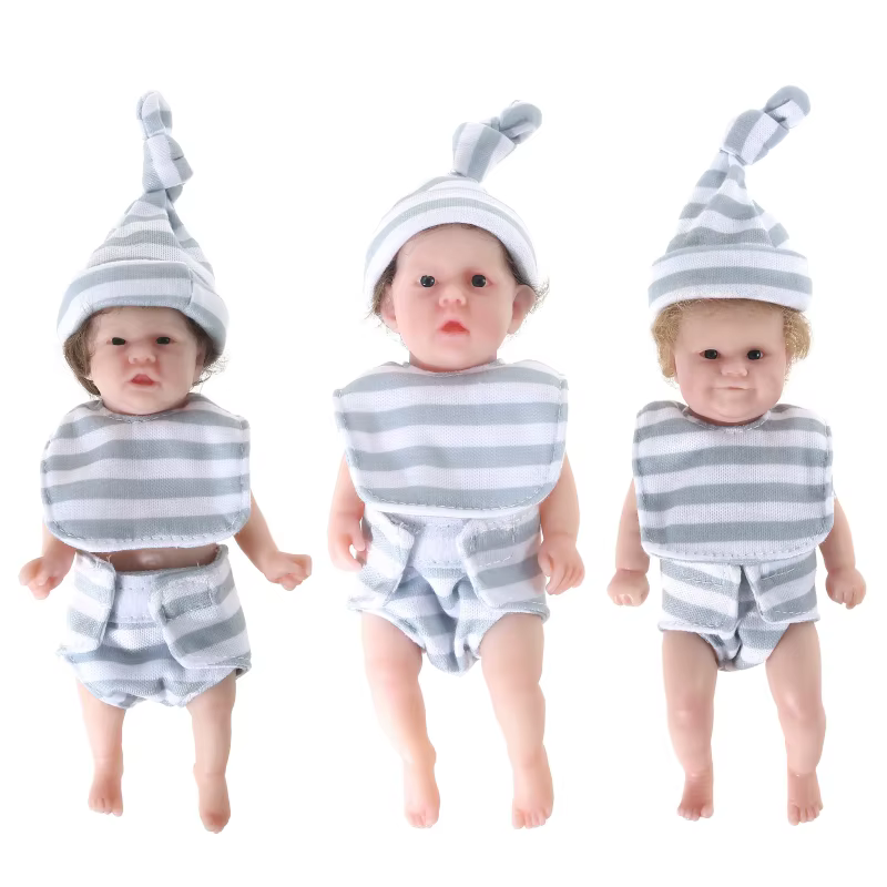 Muñeca bebé recién nacido Reborn de aspecto real con vestido delicado