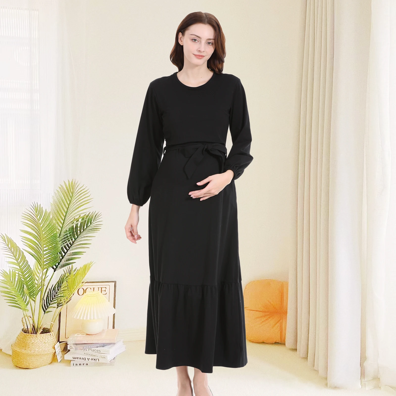 Vestido verde oscuro con corte fluido y manga larga