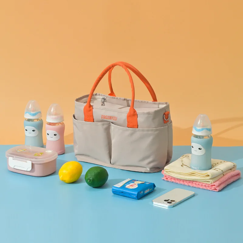 Bolso cambiador con ganchos para cochecito y bandolera cruzada