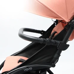 Reposabrazos Yoyo ajustable con deflector anticaída para cochecito