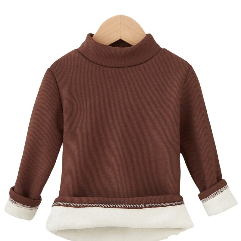 Guía de tallas impresa en la etiqueta interior de la camiseta infantil