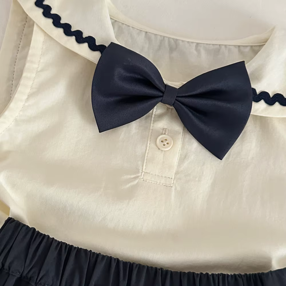 Conjunto bebé sin mangas con falda y lazo para verano