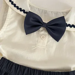 Conjunto bebé sin mangas con falda y lazo para verano