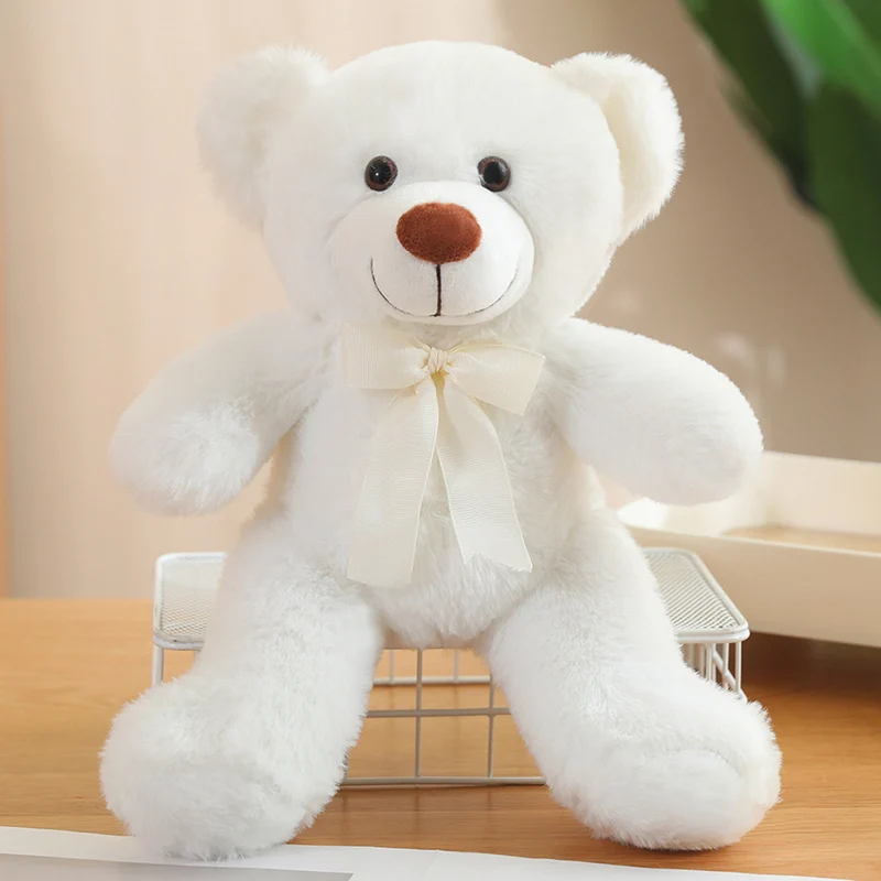 Almohada de peluche de oso pequeño Kawaii con lazo encantador