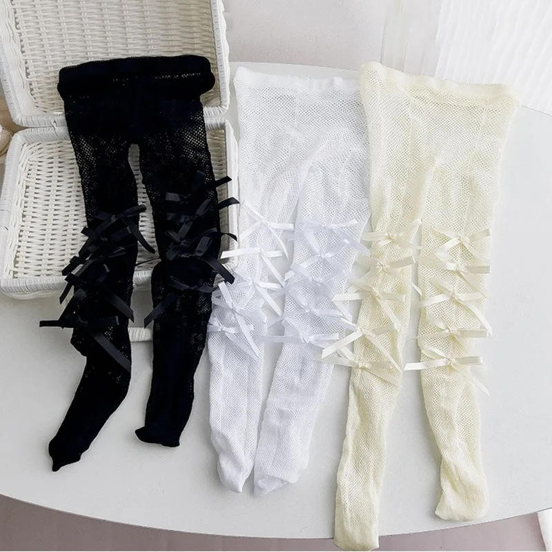Pantimedias de rejilla con lazo para niño y niña - imagen 2