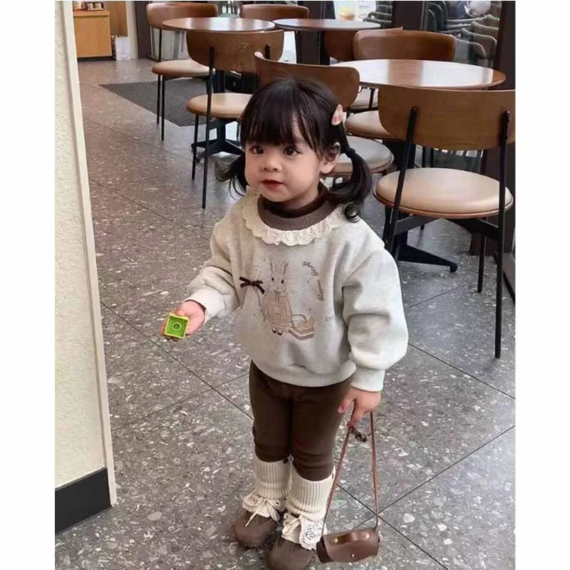 Suéter acolchado para niñas en color rosa con estampado de dibujos animados