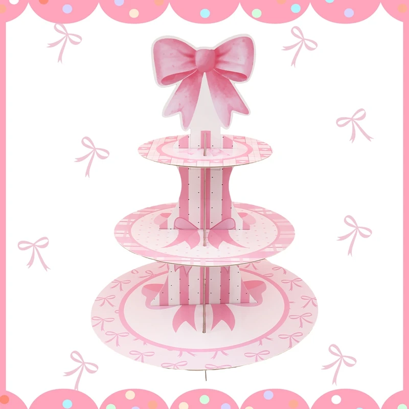 Vista frontal del soporte para pastel con lazo rosa