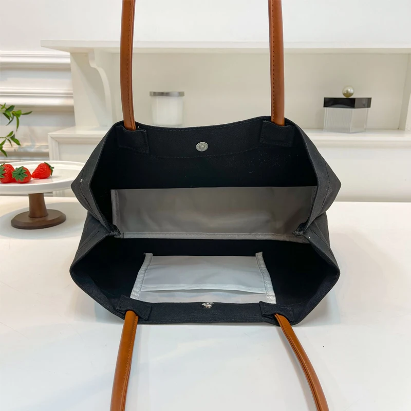 Bolso de lona blanco con bolsillo frontal