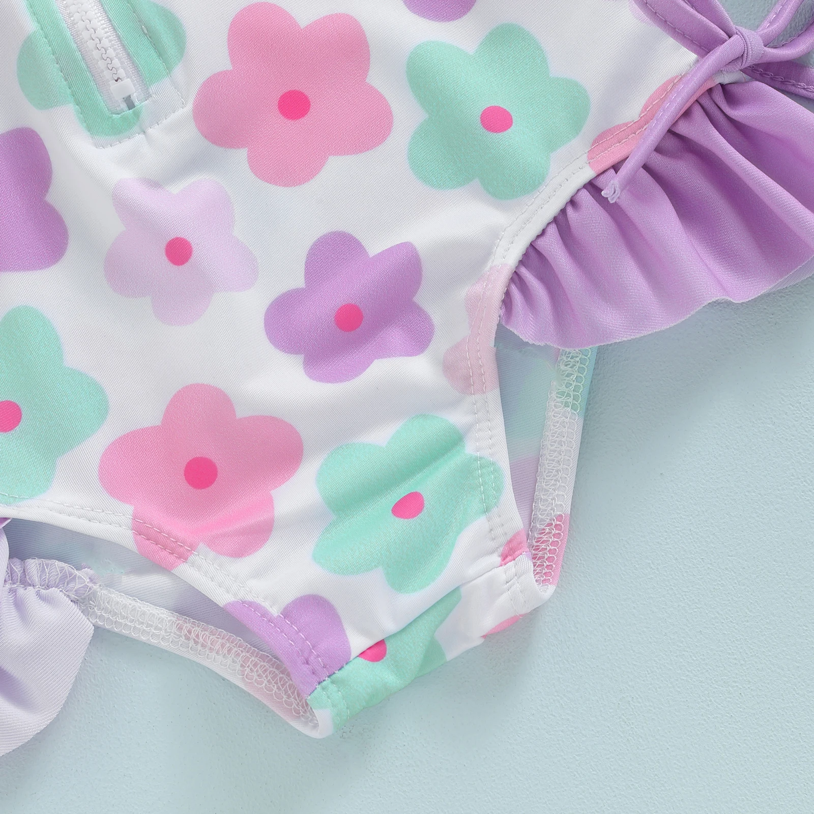 Bañador Tregren manga larga con estampado floral y gorrito para niña